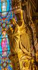 Angel statue colorful stained glass, Basilica of Notre Dame de Fourviere, Lyon, France. Art Print